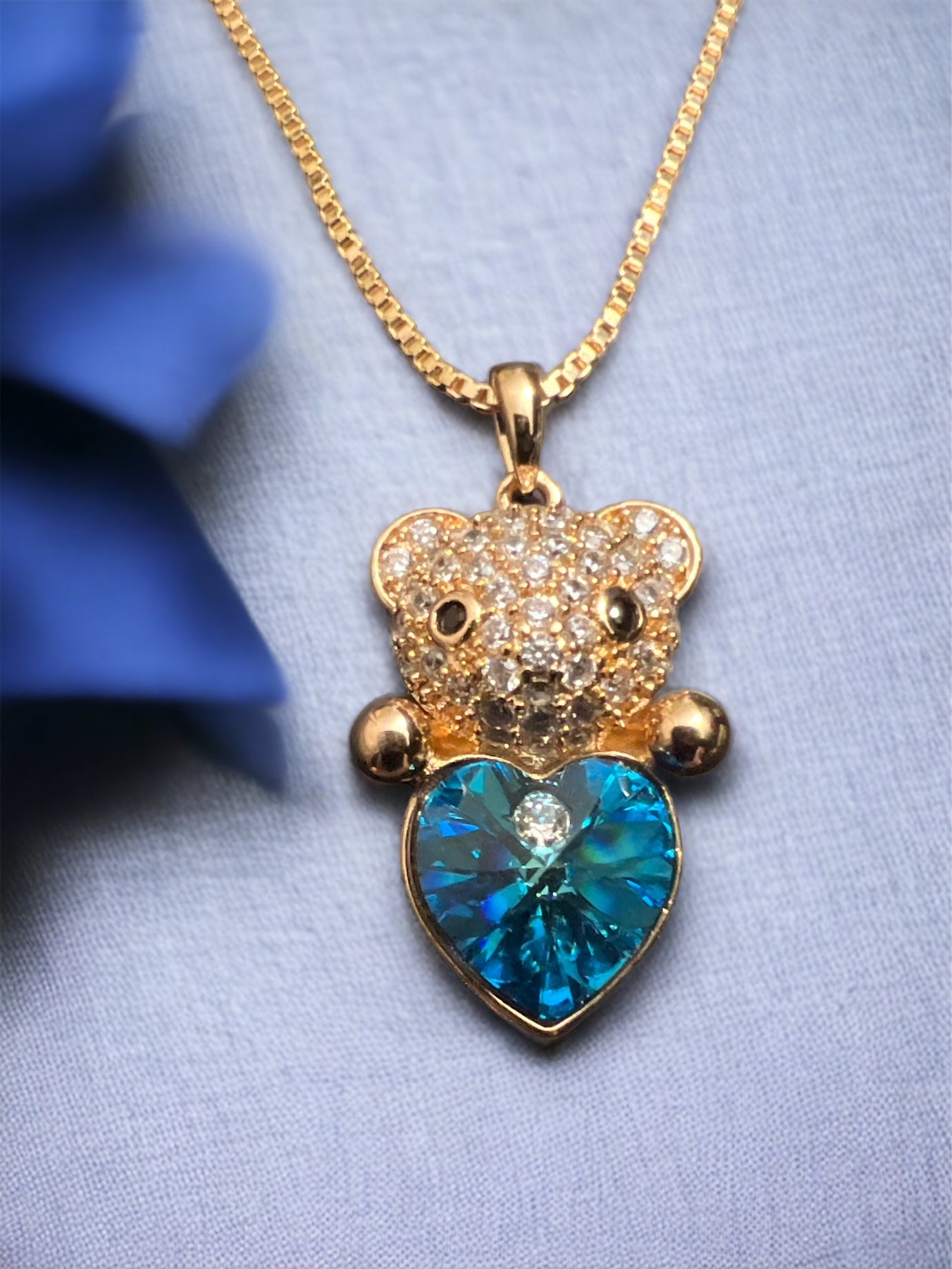 Charm and Elegance: Gold Bear with Blue Crystal Heart Gold-Plated Necklace