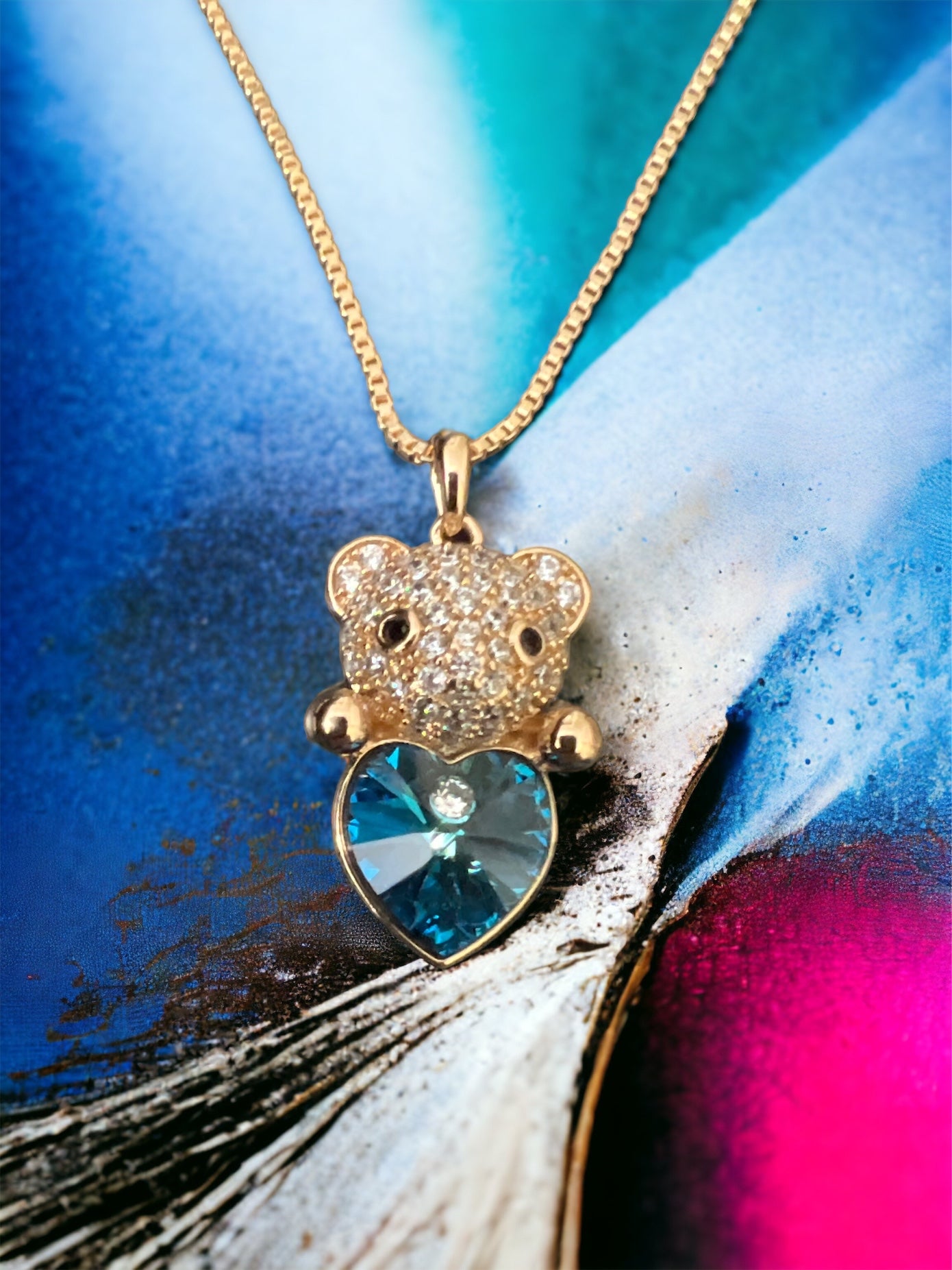 Charm and Elegance: Gold Bear with Blue Crystal Heart Gold-Plated Necklace