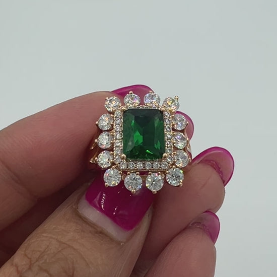 video of the golden ring with green and white cubic zircon rings