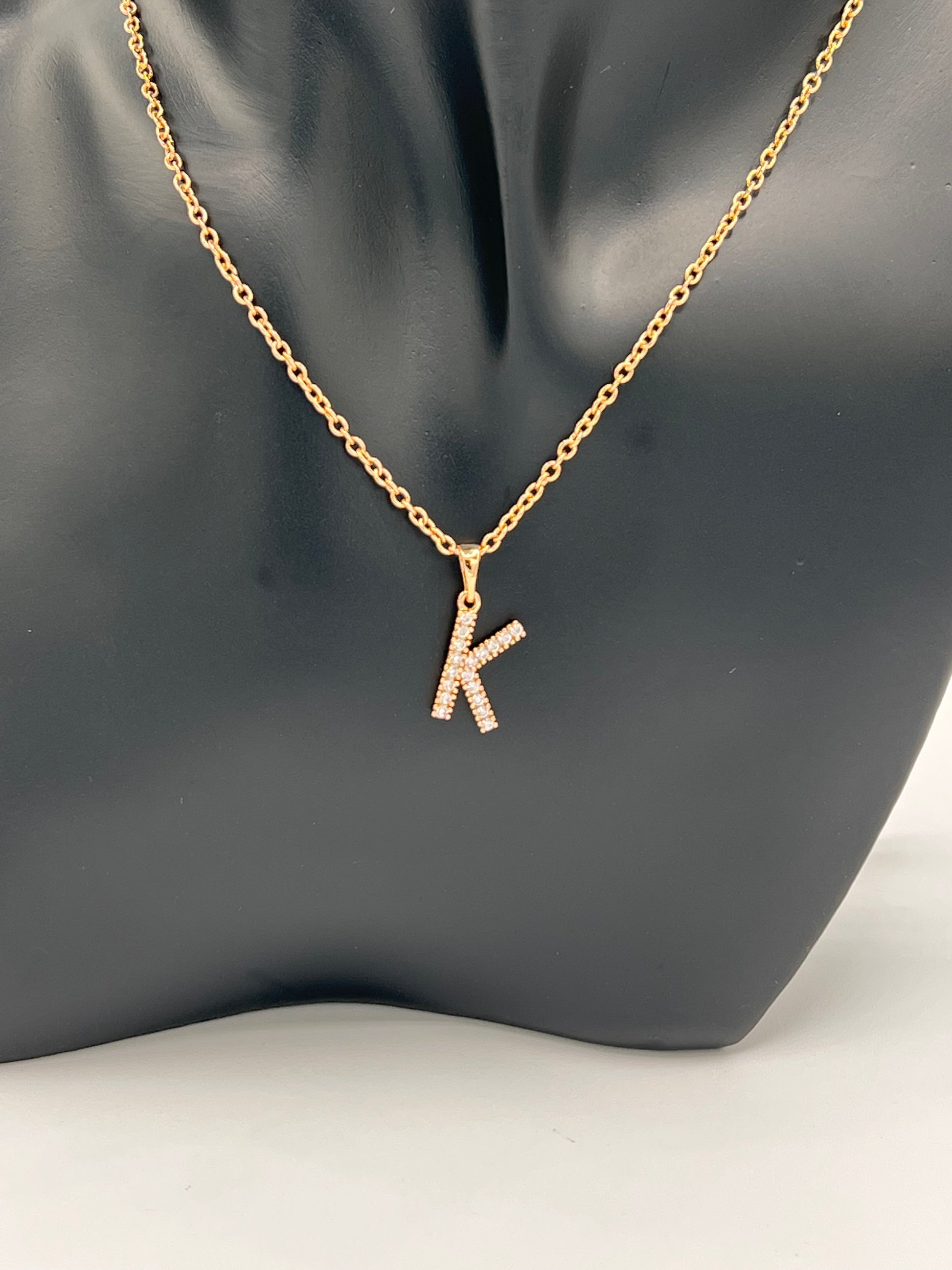40cm linked gold plated chain with Capital letter T  the letter k is embellished with 3 A cubic zircons