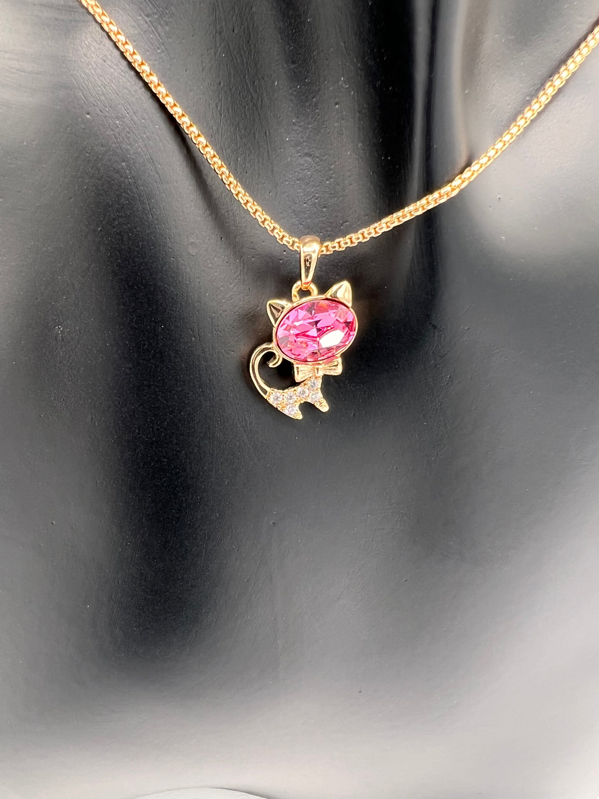 pink and gold cat pendant with gold plated chain