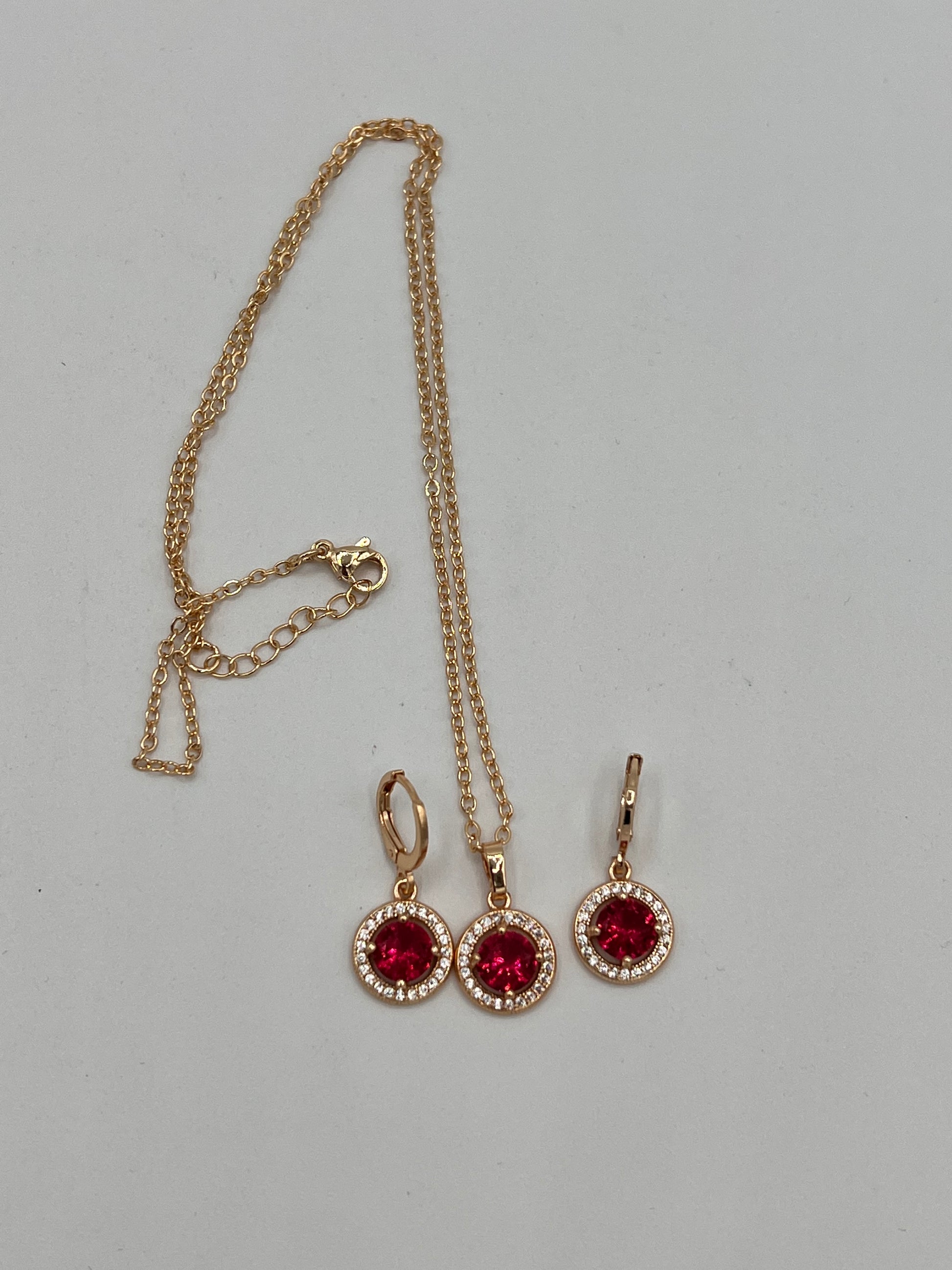 Circle design earrings and necklace sets white cubic zircons  golden circle with red round stone in the middle