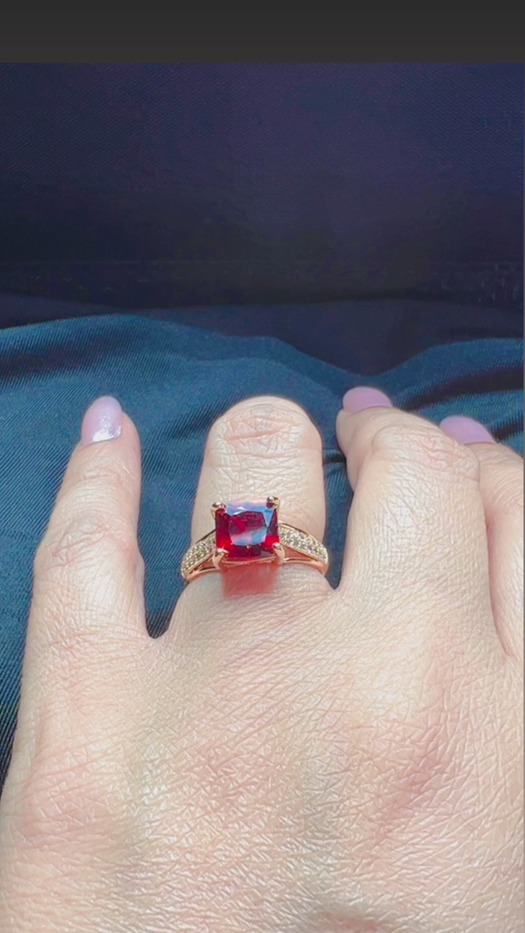 main stone on the ring is square blood red and band is embellished with white cubic zircons